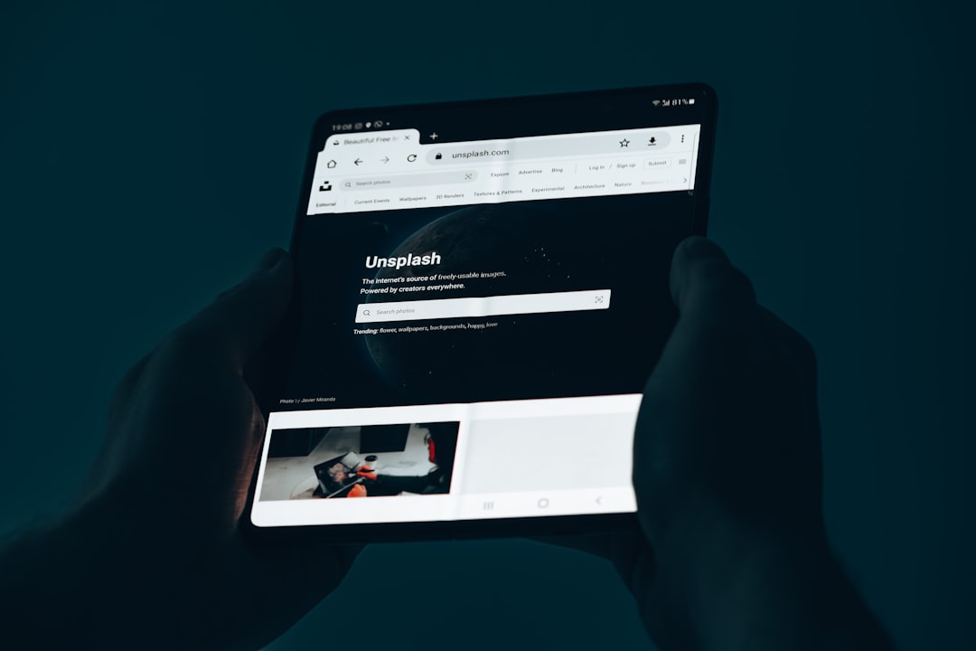 Unsplash website on Samsung Galaxy Z Fold 3. Dark.